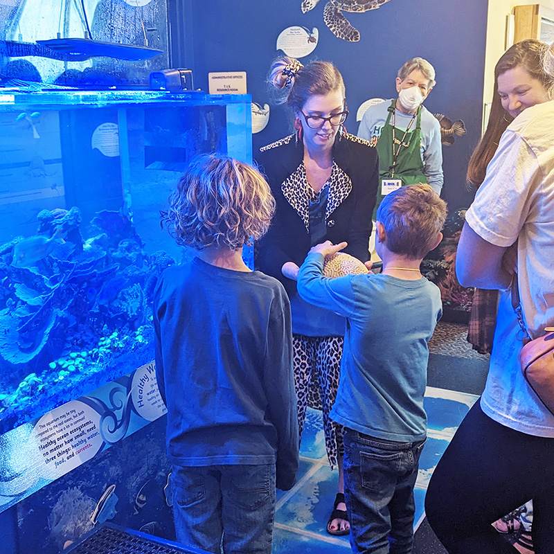 WonderLab Animal Exhibits Manager, Sam Couch, leads a program about the coral reef aquarium.